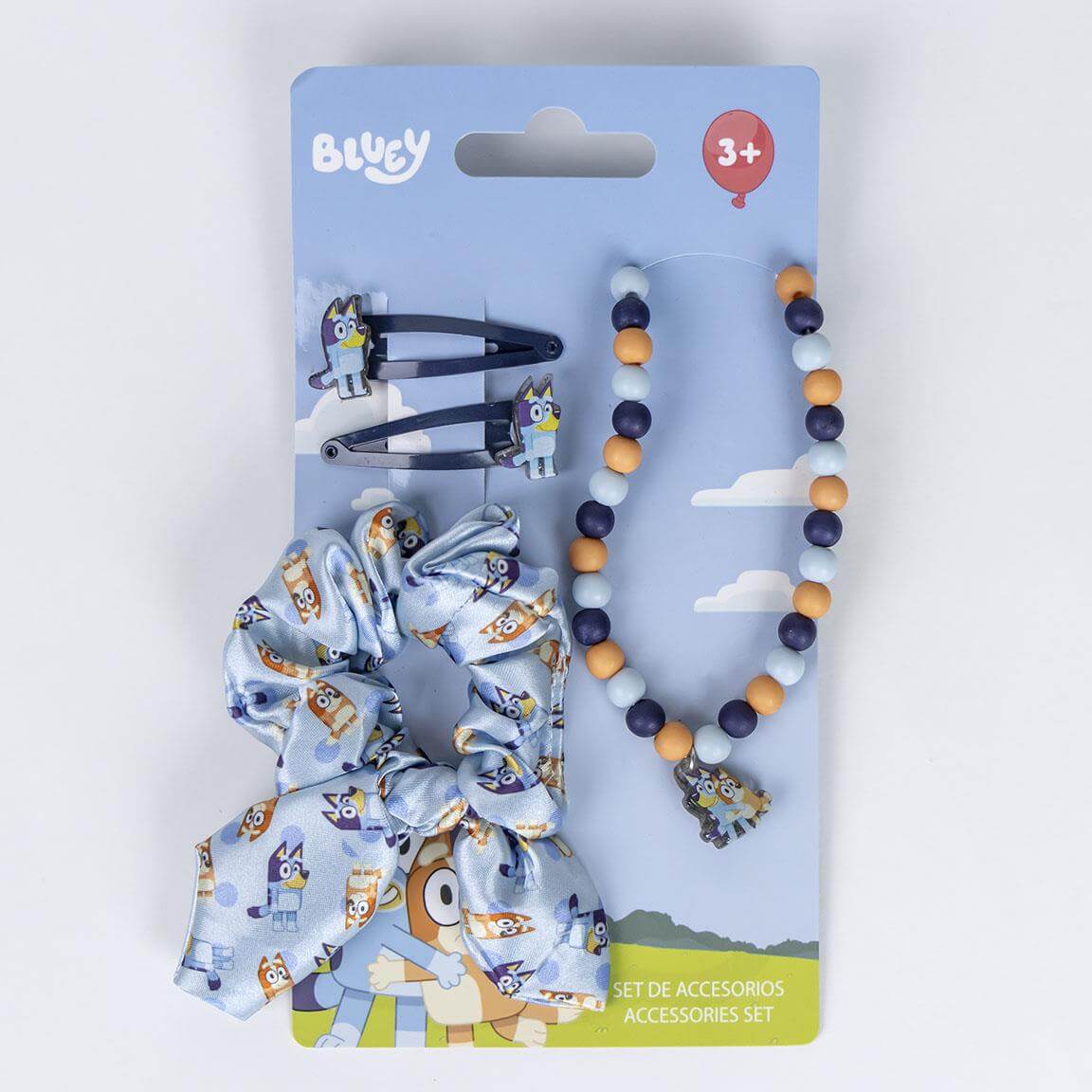 Bluey Hársett with hair clips, scrunchie, and necklace for kids, featuring colorful Bluey design on packaging.