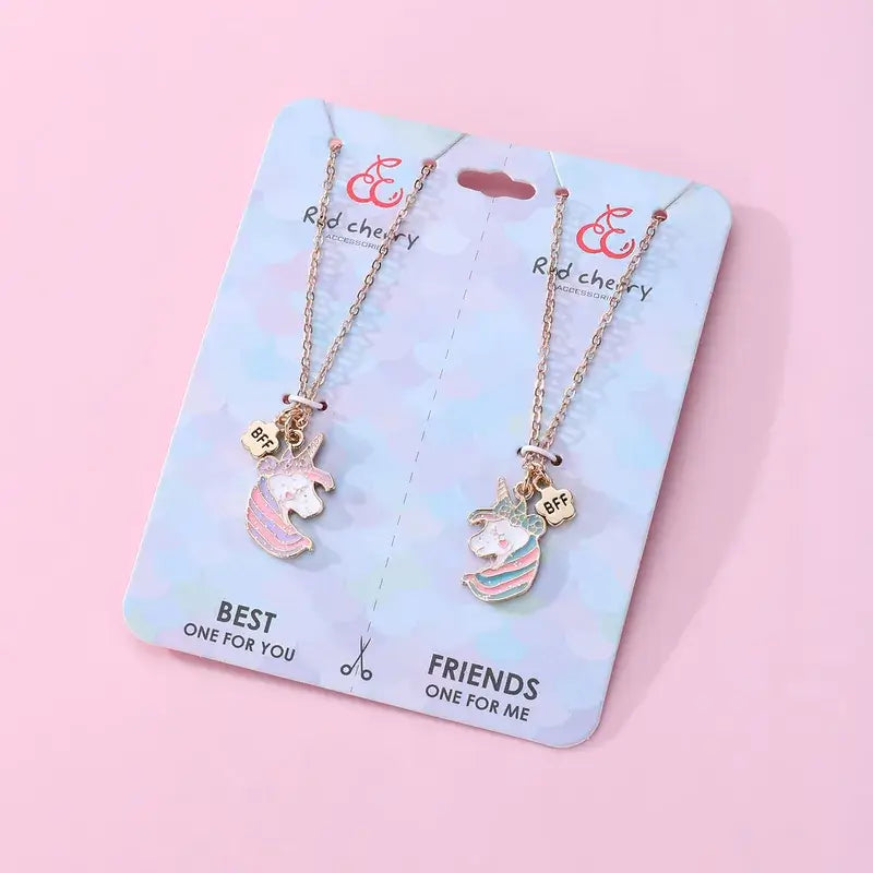 Hálsmen Einhyrninga haus -glimmer - BFF necklaces on card, heart-shaped unicorn heads with glitter, perfect for best friends or sisters.