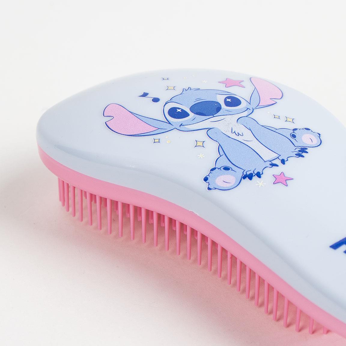 Cute hairbrush with cartoon character design, featuring blue and pink accents on a white background, ideal for children.