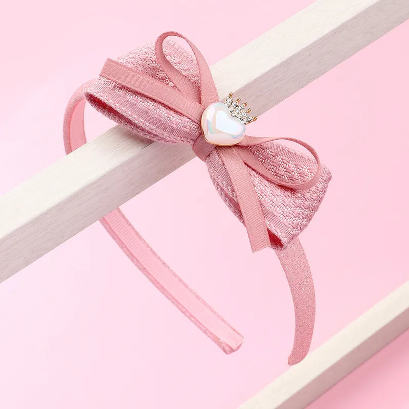 Hárspöng glimmer með slaufu og hjartasteini