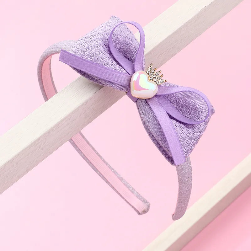 Hárspöng glimmer með slaufu og hjartasteini